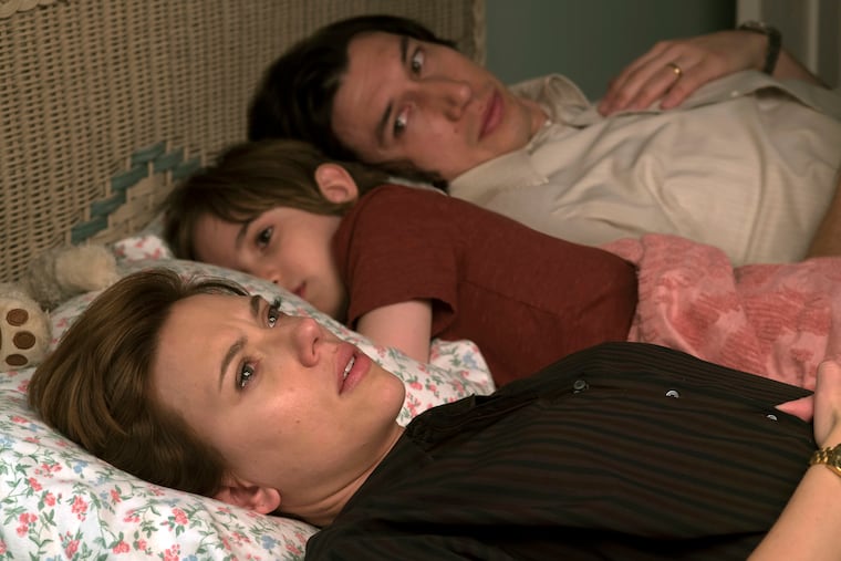 This image released by Netflix shows Scarlett Johansson, left, and Adam Driver in "Marriage Story." The film is nominated for an Oscar for best picture. Johansson and Driver were also nominated for best leading actress and leading actor. (Netflix via AP)