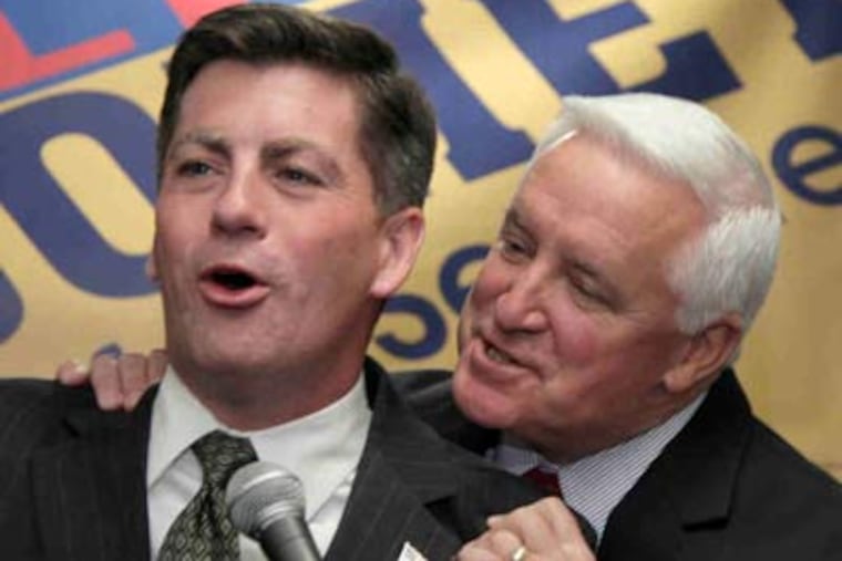 Jim Cawley, left, the lieutenant governor-elect, with Gov.-elect Tom Corbett during a rally. (Carolyn Kaster / Associated Press)