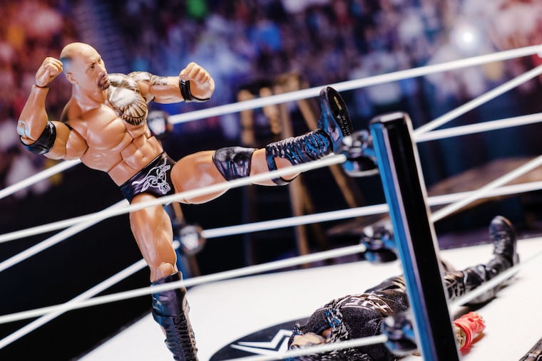 The People's Elbow by The Rock, as depicted by action figures.