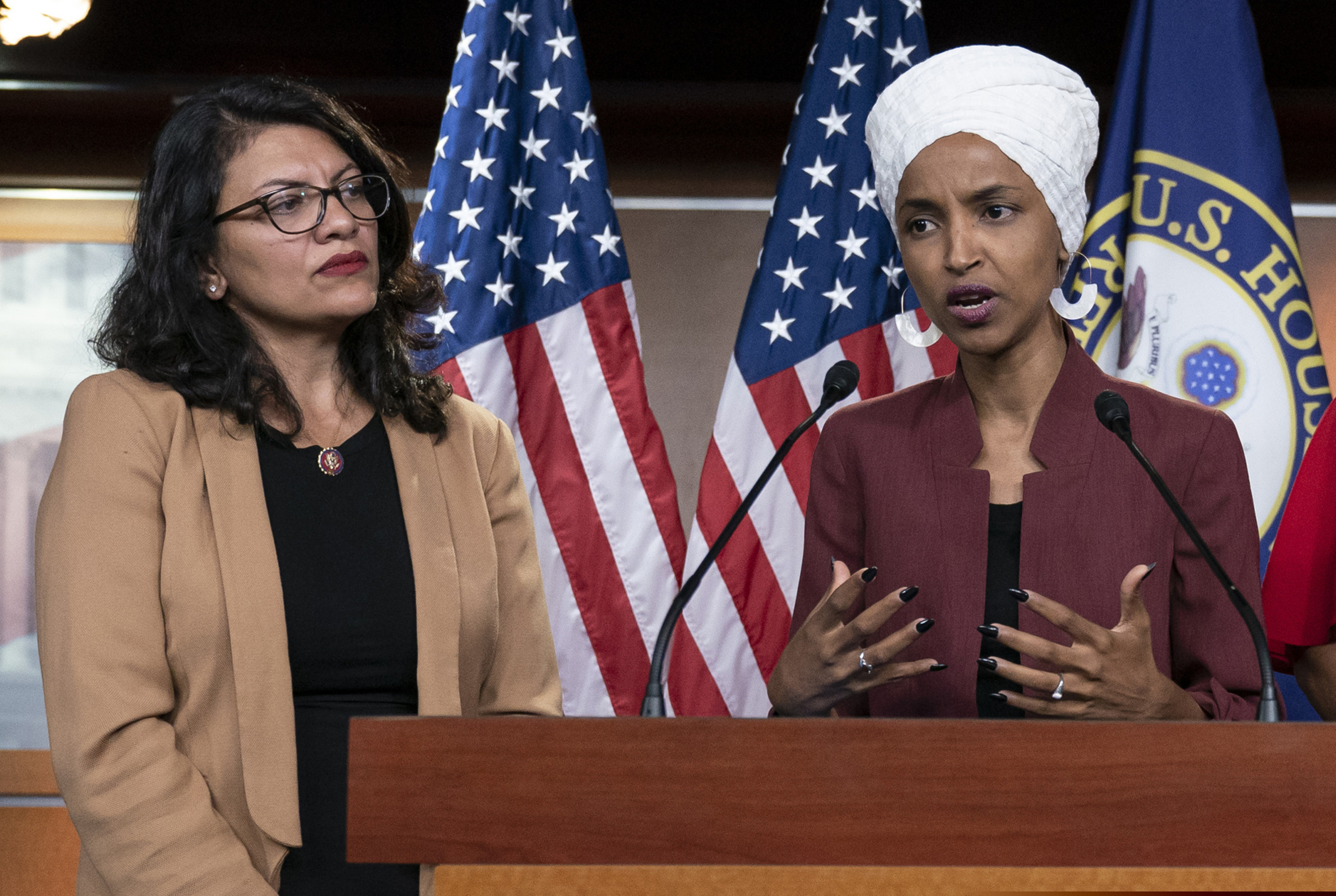 FILE - In this July 15, 2019, file photo, U.S. Rep. Ilhan Omar, D-Minn, right, speaks, as U.S. Rep. Rashida Tlaib, D-Mich. listens, during a news conference at the Capitol in Washington. In the eyes of critics, Benjamin Netanyahu’s decision to bar two Democratic congresswomen at the request of President Donald Trump is the latest reckless gamble by a prime minister willing to sacrifice Israel’s national interests for short-term gain. And yet the pursuit of such allegedly short-term gains has kept Netanyahu in power for more than a decade.
