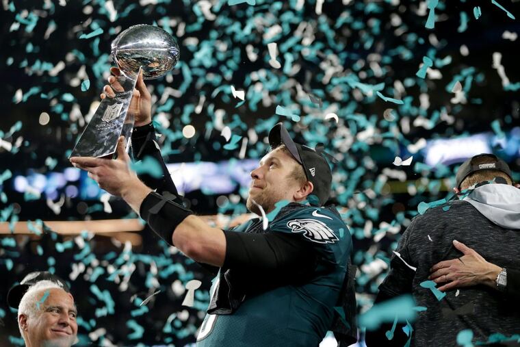 Nick Foles admires the Lombardi Trophy after he passed for 373 yards and three touchdowns in an MVP performance. He’ll be back for the 2018 season.