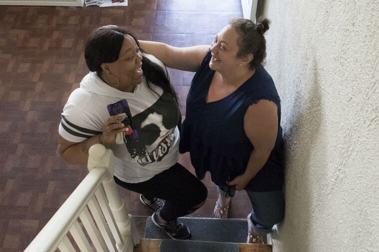 Shannon Rowell (left) and Hannah Angert inside Rowell's new home in North Philadelphia. When Angert learned of Rowell's miserable home-buying process, she decided to throw her a big virtual housewarming party.