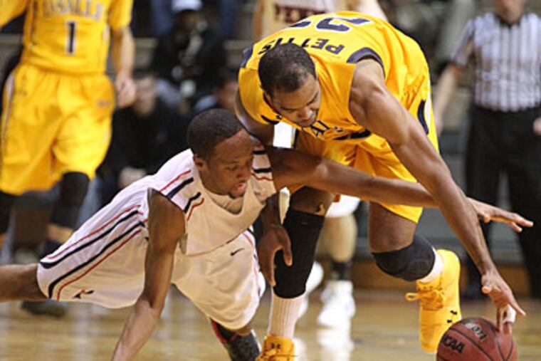 La Salle takes on Temple and Penn faces St. Joe's tonight in a pair of Big 5 matchups. (Charles Fox/Staff Photographer)
