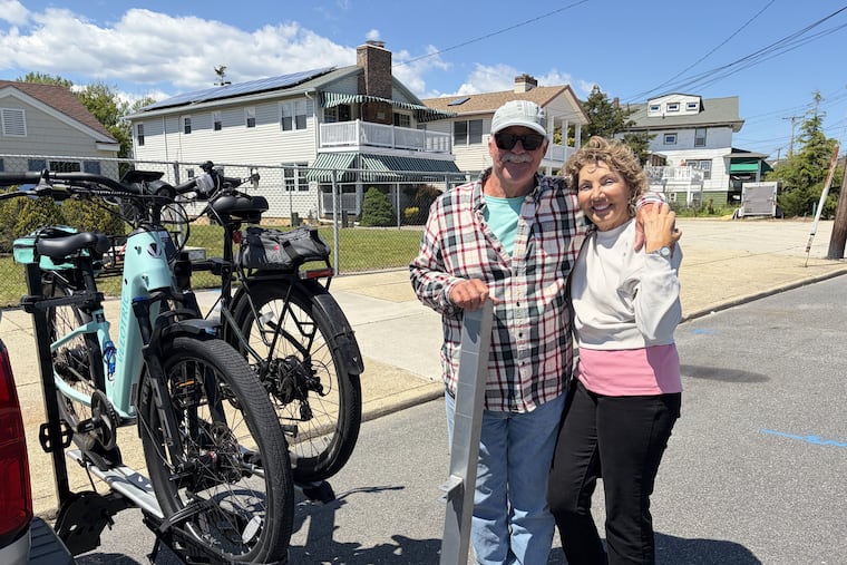 Mike and Annamarie Carr of Ventnor, owners of Jagielky's candy shops, with the e-bikes they love to ride.