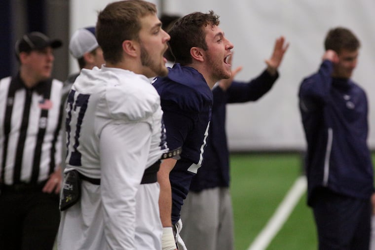 Penn State football tight end Pat Freiermuth (87) and quarterback Sean Clifford (14) during practice on Dec. 20, 2019, before the team left for Dallas and their Cotton Bowl matchup against Memphis. Several programs, not including football, have halted team activities after 48 positive results were found in tests of 920 student-athletes.