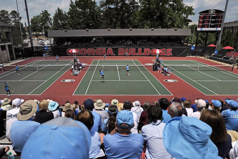 Spectators crowd center court at the Dan Magill Tennis Complex during the UCLA and North Carolina women's doubles match in the NCAA Division I tennis championships May 20, 2014, in Athens, Ga.