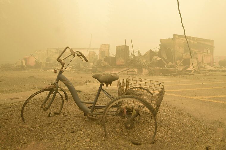 A trike that was in a small park along Detroit Avenue still stands near the Lake Detroit Market on Friday in Detroit, Ore.