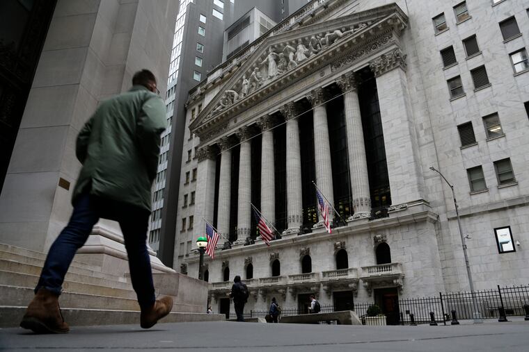People pass the front of the New York Stock Exchange in New York on Wednesday.