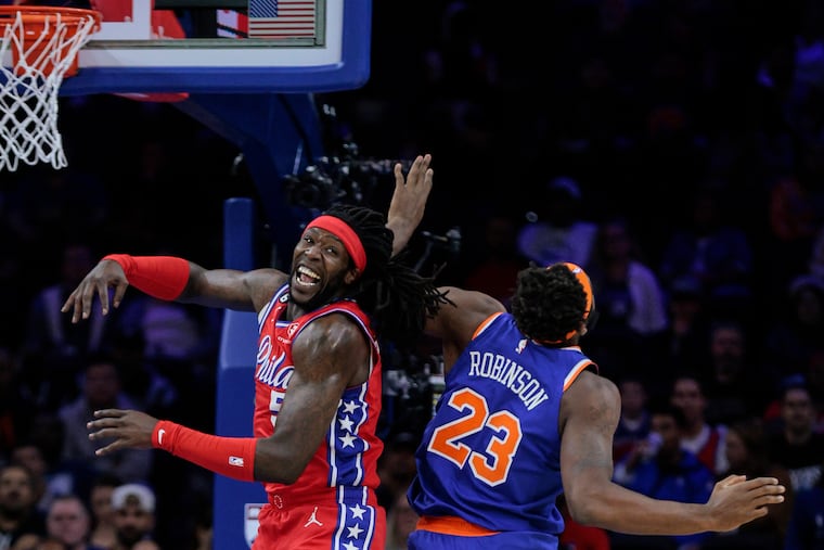 Sixers Montrezl Harrell misses a rebound with Knicks Mitchell Robinson during the 1st quarter at the Wells Fargo Center in Philadelphia on Nov. 4.