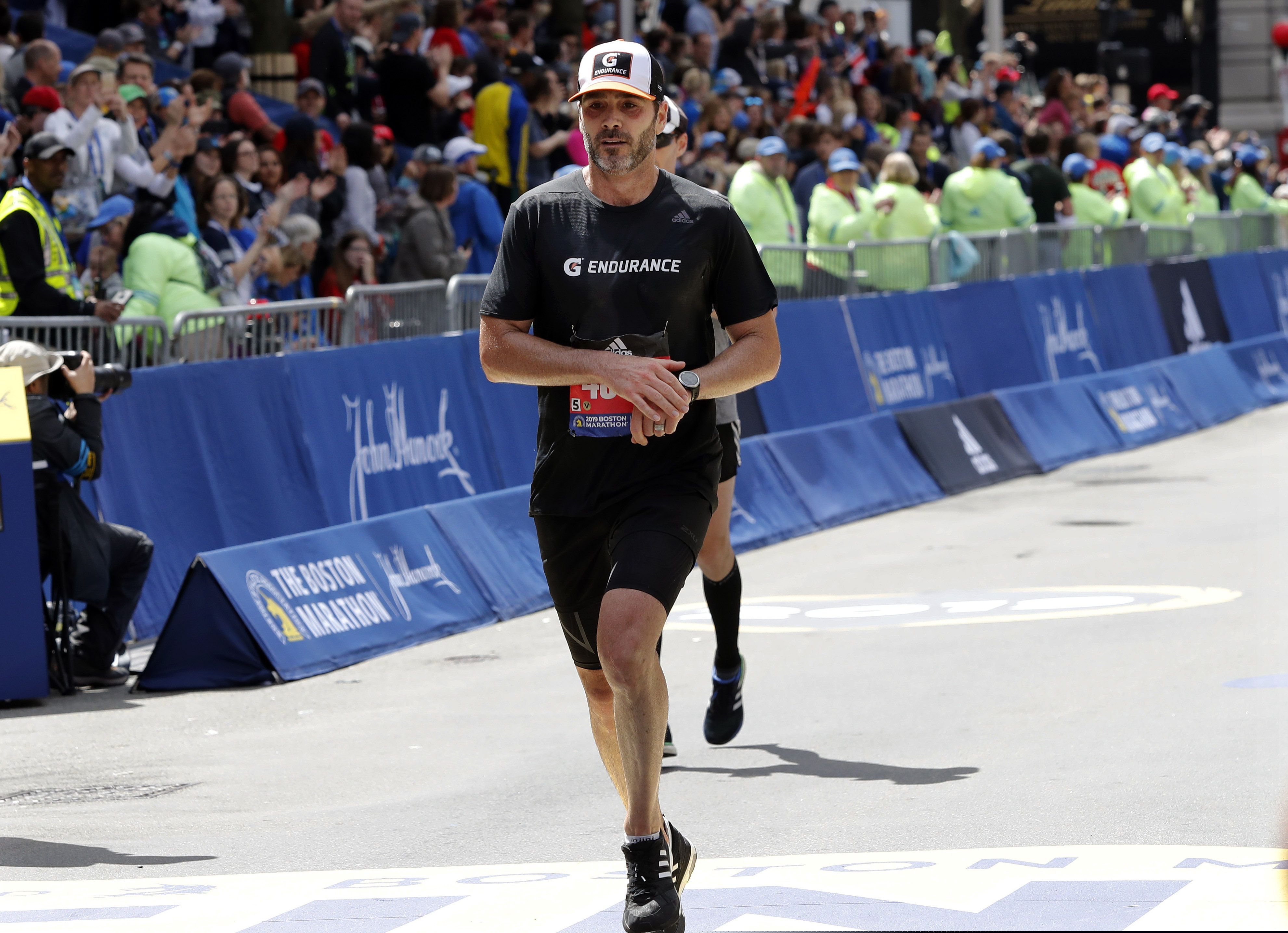 NASCAR driver Jimmie Johnson finishes the 123rd Boston Marathon on April 15.
