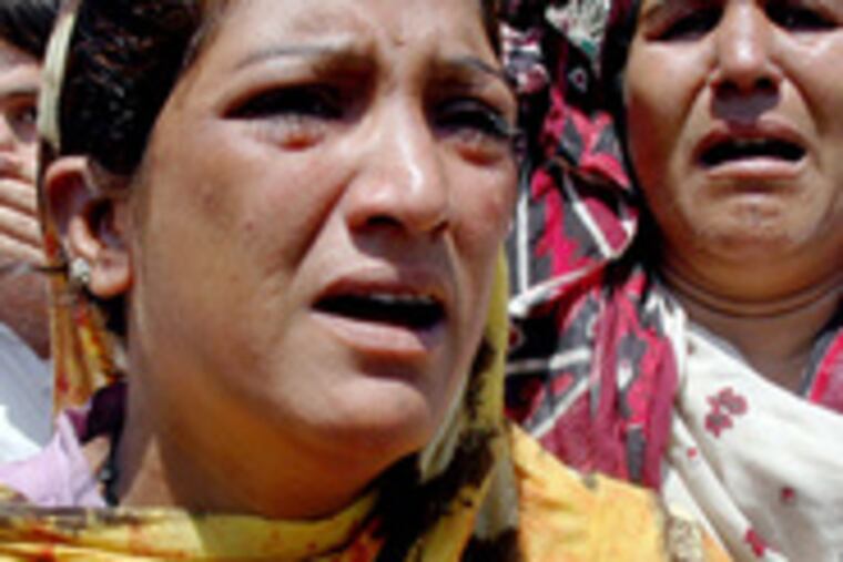 Women mourn after a bombing in Matta, Pakistan, in the Swat region on the Afghan border. Pakistani forces have been massing in the region.
