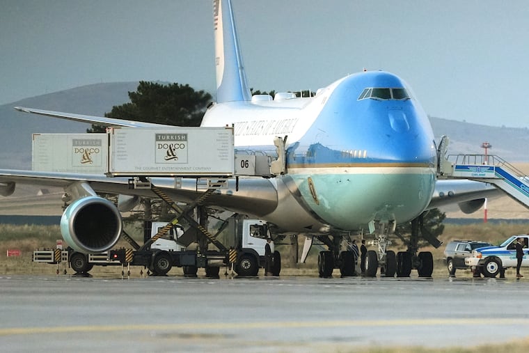 Catering trucks are parked at Air Force One on the tarmac as the motorcade carrying U.S. President Donald Trump arrives on the tarmac to depart following the NATO summit at Ankara International Airport in Ankara, Turkey, Wednesday, July 8, 2026.