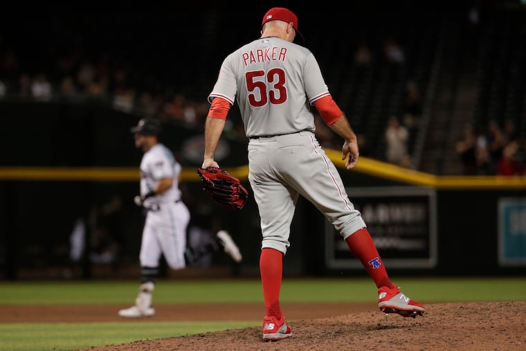 Reliever Blake Parker kicks the dirt on the mound after giving up a two-run home run to Arizona's David Peralta in the seventh inning of the Phillies' 8-4 loss Tuesday night at Chase Field.