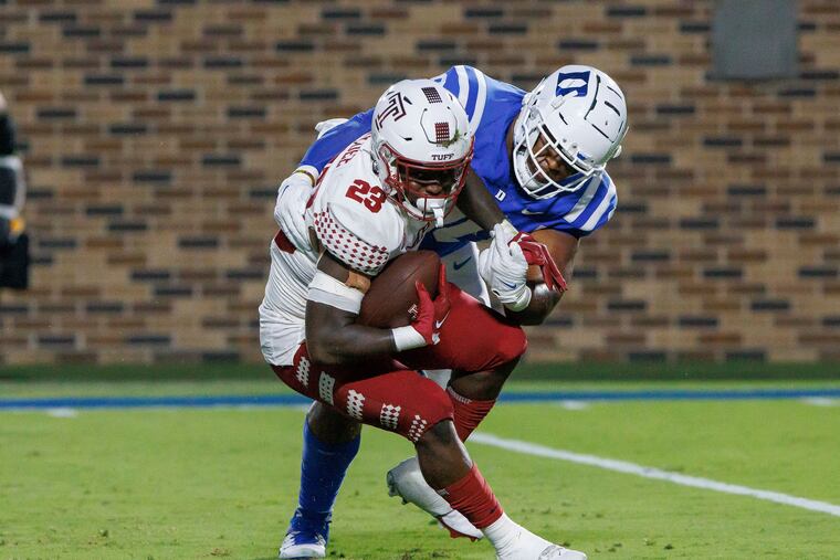 Temple's Edward Saydee (23) is tackled in the backfield by Duke's DeWayne Carter, right, during the first half of an NCAA college football game in Durham, N.C., Friday, Sept. 2, 2022. (AP Photo/Ben McKeown)