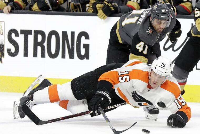 Vegas’ Pierre-Edouard Bellemare , here reaching under the Flyers’ Jori Lehtera (15) during the teams’ meeting last month, will make his return to the Wells Fargo Center.