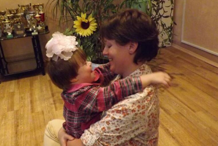 Jody Johnson, of Schwenksville, a tech sergeant at the Horsham Air Guard Station, visted with Oksana, the six year old Russian orphan that Johnson hoped to adopt.