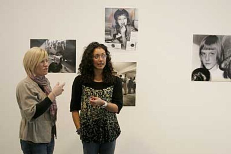 Lisa Haskell, left, and Watsuli Harrington, were among the Moore students who curated "Women Through the Lens of Time: Students Select From 180 Years of Photojournalism in the Philadelphia Inquirer." (Charles Fox / Staff Photographer)