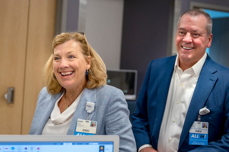 Inspira Health CEO Amy B. Mansue (left) said New Jersey hospitals are going to have to change the way they operate to bring expenses in with revenue when they lose an estimated $3.6 billion in Medicaid revenue through 2032. Mansue is shown with Inspira's chief operating officer Warren E. Moore in 2024.