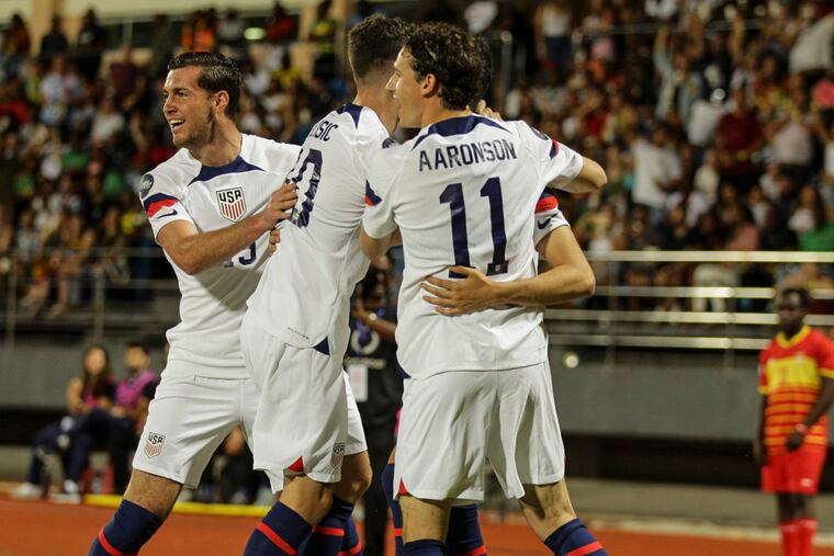 Medford's Brenden Aaronson (center) celebrates with teammates after one of the U.S. goals.