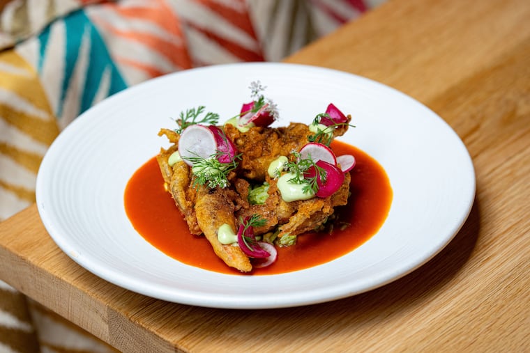 Beer-battered soft-shell crab with green rice, salsa roja, and epazote mayo at Condesa.