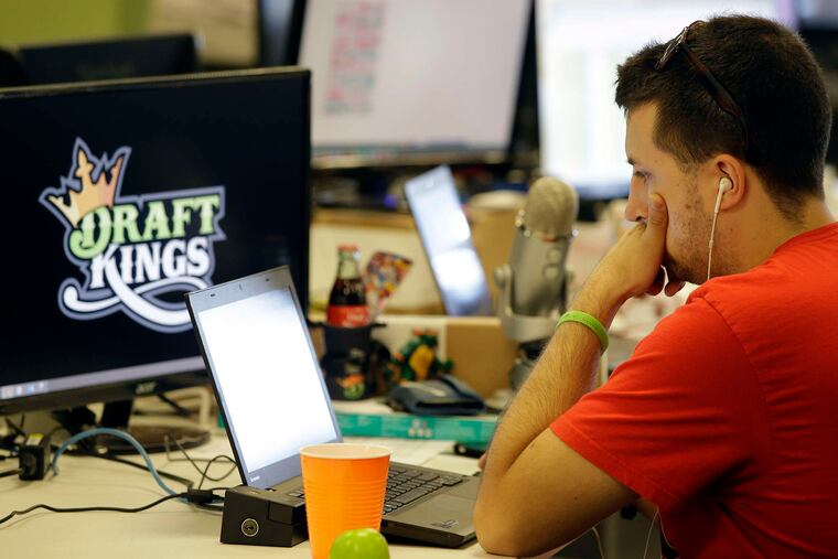 A worker at DraftKings' Boston offices. After a ruling was reversed Friday, the two big fantasy sports companies can continue to do business in New York state.