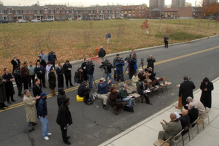 Councilwoman Jannie L. Blackwell (far right) and Carl Greene (at lectern), PHA executive director, at the news conference. The center is to be built on the site in rear, at 47th and Aspen Streets.