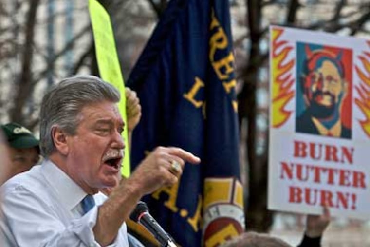 Harold A. Schaitberger, general president of the International Association of Firefighters, speaks during a rally with about 2,000 firefighters and supporters at City Hall on Monday. (John Costello / Staff Photographer)