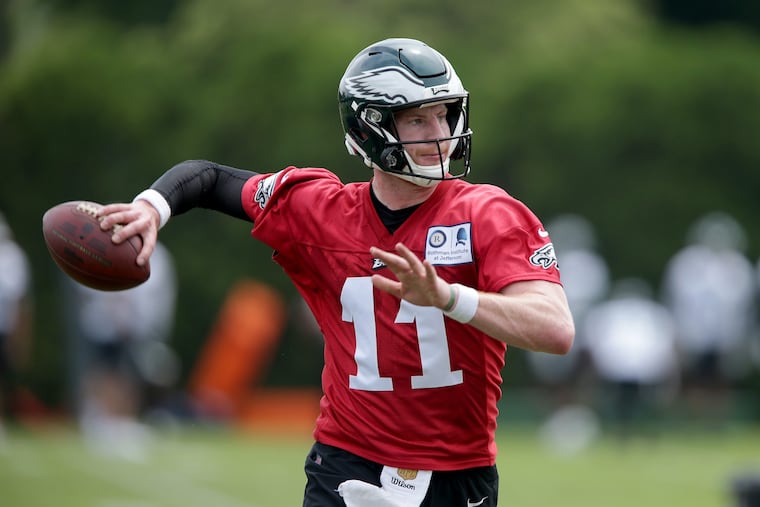 Eagles' Carson Wentz looks to throw the ball as the Eagles hold OTA's at the NovaCare Complex in Philadelphia, PA on May 29, 2018. DAVID MAIALETTI / Staff Photographer
