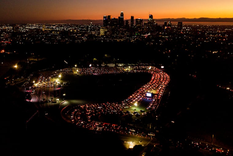 Motorists wait in long lines to take a coronavirus test in a parking lot at Dodger Stadium in Los Angeles. Health experts around the country are hoping the incoming Biden administration will put in place a comprehensive national testing strategy.