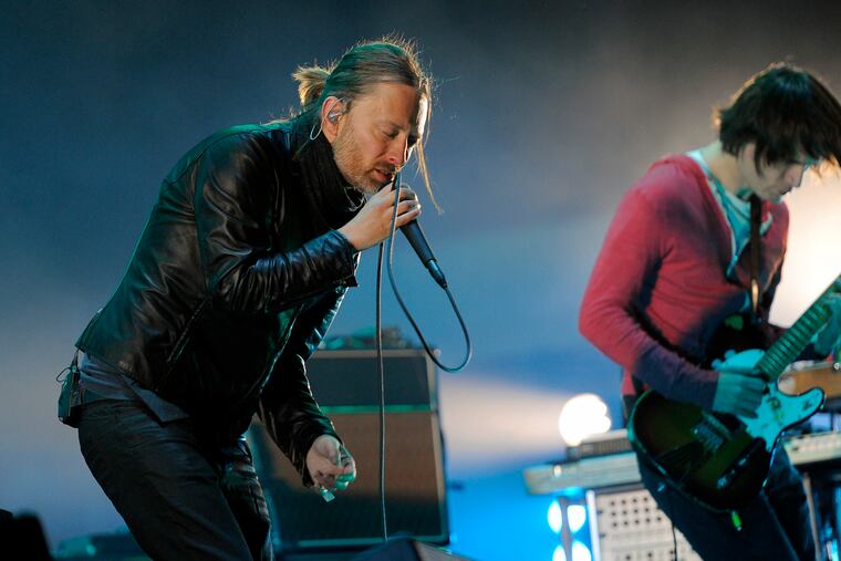 FILE - In this April 14, 2012 file photo, Thom Yorke, left, and Jonny Greenwood of Radiohead perform during the band's headlining set at the 2012 Coachella Valley Music and Arts Festival in Indio, Calif. Radiohead says a trove of unreleased music has been stolen and is being used for ransom, but instead of paying up, the band announced Tuesday June 11, 2019, they will release it in aid of environmental activist group Extinction Rebellion.