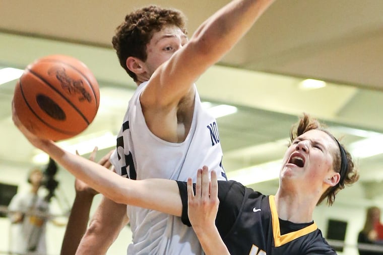 Central Bucks West’s Shane McCusker, right, drives to the basket against North Penn last season.