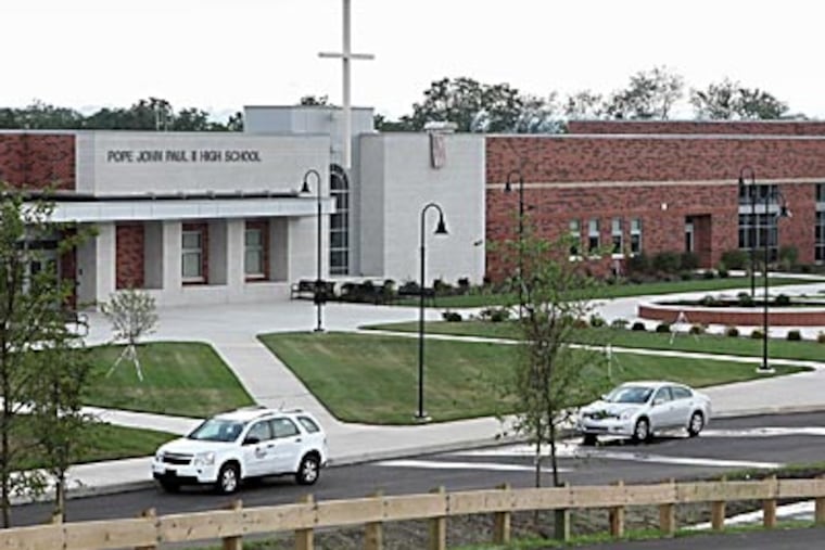 Pope John Paul II High School has two gyms and a 1,200-seat auditorium. An archdiocesan official said technology ensured the school would be competitive with the best public and private schools. (DAVID M WARREN / Staff Photographer)