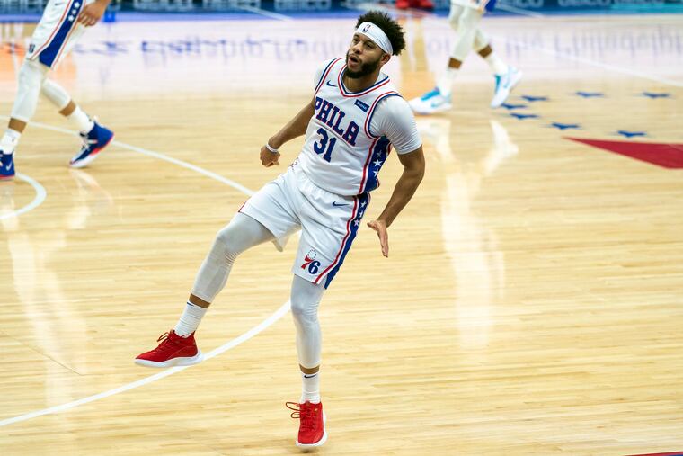 Sixers guard Seth Curry reacts to his three-point shot during the first half of Wednesday's gme against the Washington Wizards.