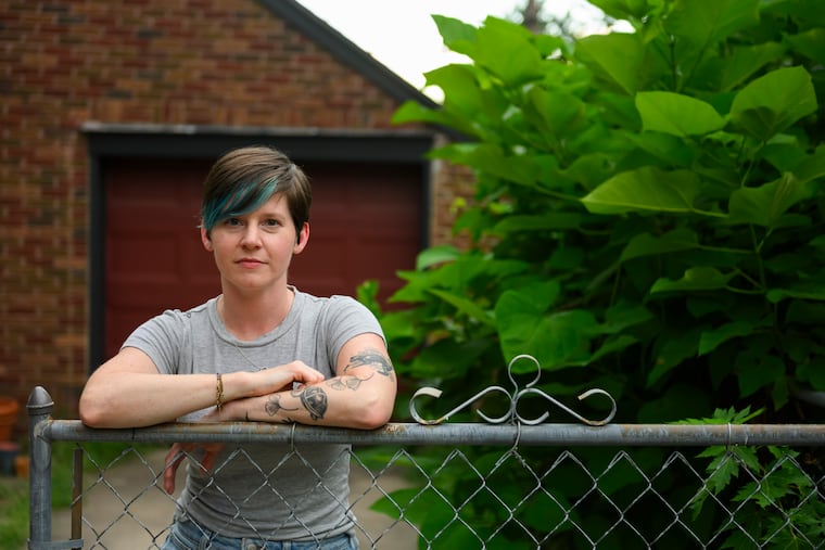 Cori Lint has premenstrual dysphoric disorder, known as PMDD, which is a negative reaction in the brain to natural hormonal changes in the week or two before a menstrual period. Even as Lint struggles to find medicine that brings relief from symptoms, including, at the extreme, panic attacks and suicidal thoughts, she says tracking her cycle has helped. (Michael Noble Jr. for KFF Health News)