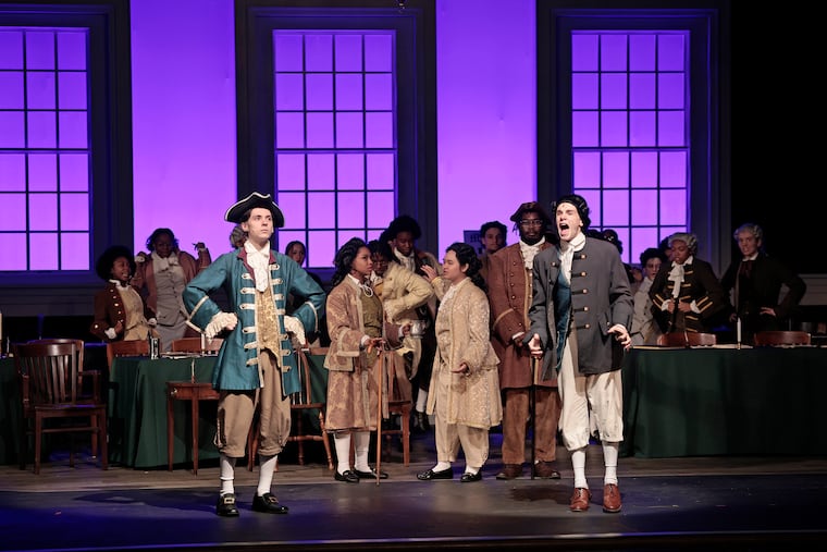 Thomas Jefferson (played by Maxwell Henderson, left) and John Adams (played by Jackson Preisser, right) argue during a scene from the opening night of 1776: The Musical at the Philadelphia High School for Creative and Performing Arts on Wednesday, June 24, 2026.