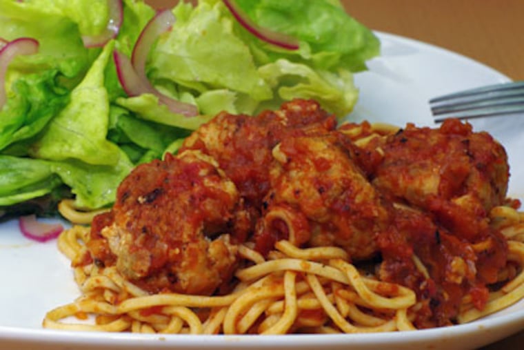 The finished dish -- Chicken and Ricotta Meatballs, handmade pasta, salad. (Photo: Joy Manning)