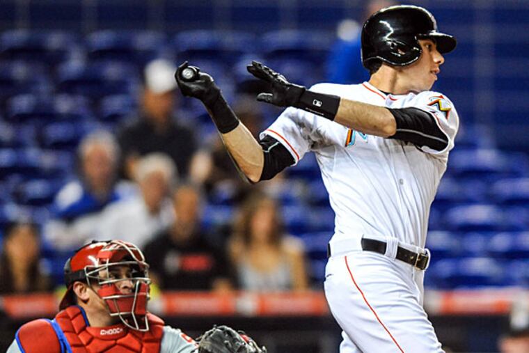 Miami Marlins center fielder Christian Yelich (21) connects for a base hit during the first inning against the Philadelphia Phillies at Marlins Park.
