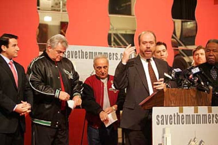 (Left to right) State Sen.-elect Larry Farnese, U.S. Rep. Bob Brady, Joey Vento of Geno's Steaks and George Badey, an attorney for the Mummers, announce the donations. (David Swanson / Staff Photographer)