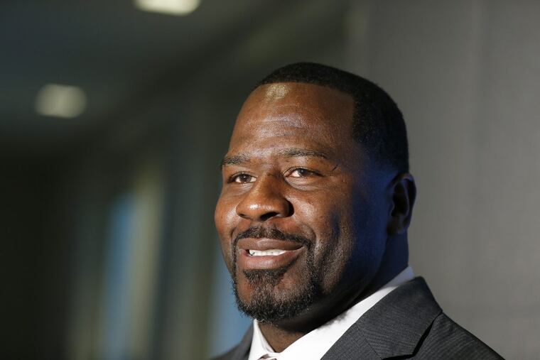 Former Eagle Jeremiah Trotter, here talking to reporters in 2016, has a son making big hits for St. Joseph’s Prep.