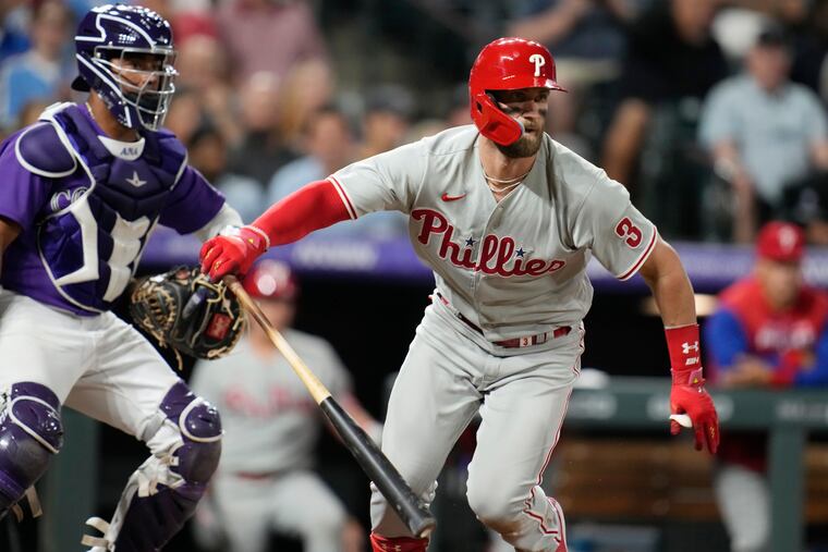 The Phillies’ Bryce Harper breaks from the batter’s box during Tuesday's game in Denver.