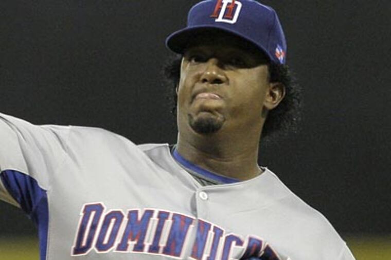 The Phillies may be adding Pedro Martinez to their rotation. (Andres Leighton / AP file photo)