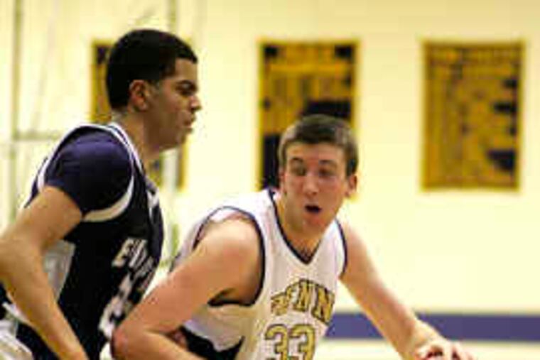 Episcopal Academy's Isaiah Baker guards Penn Charter's Tom Noonan. Baker and Noonan each had a game-high 17 points.