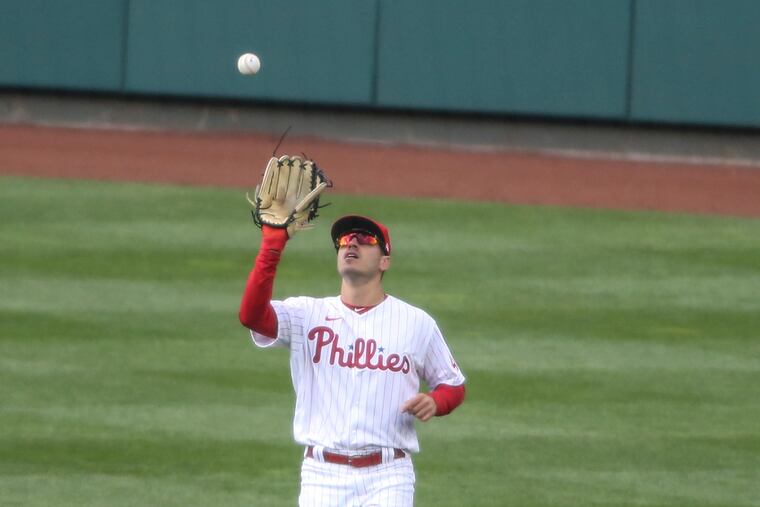 Phillies center fielder Adam Haseley catches a fly ball to the seventh inning. He was lifted before the eighth with tightness in his left hamstring.