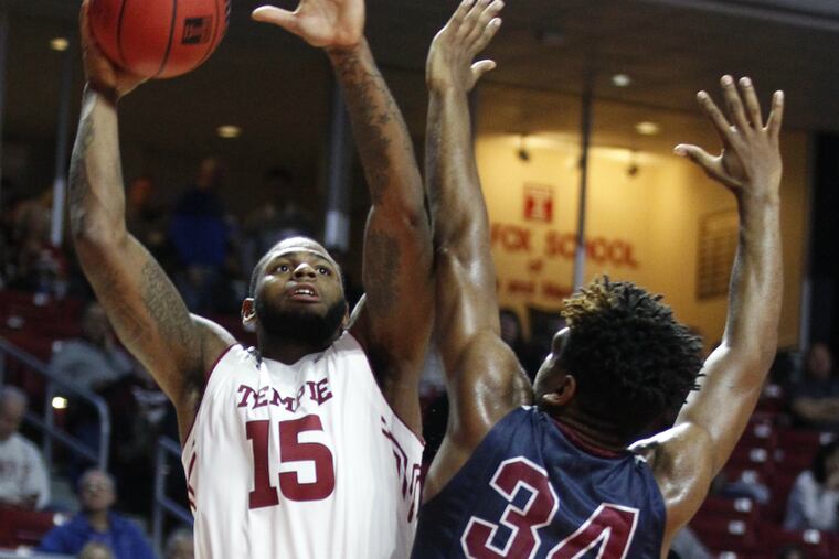 Temple's Jaylen Bond shoots over Mike Holloway in the first half. (Charles Fox / Staff Photographer)