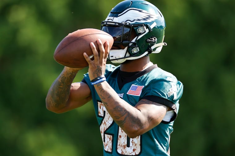 Eagles running back Miles Sanders catches the football during training camp Saturday at the NovaCare Complex.