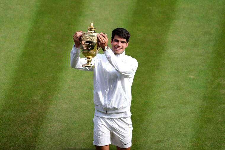Carlos Alcaraz celebrate after his victory over Novak Djokovic in the men's final at the Wimbledon.