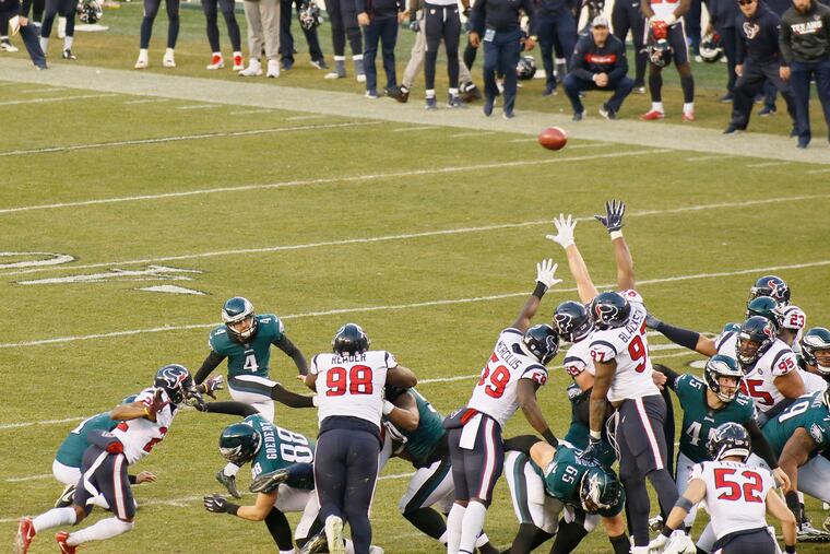 Jake Elliott kicks the game-winning field goal in the waning seconds of the fourth quarter.
