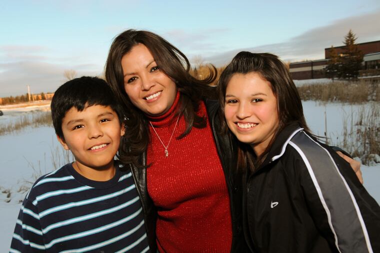 This photo provided by PBS shows Robin Poor Bear, center, an Oglala Sioux woman and 32-year-old divorced single mother living on North Dakota’s Spirit Lake Reservation, along with her children, Anthony, left, and Darian. Poor Bear and her children are the subject of a documentary, “Kind Hearted Woman,” airing Monday, April 1, 2013, and Tuesday, April 2, on PBS. (AP Photo/PBS, Kimmer Olesak)