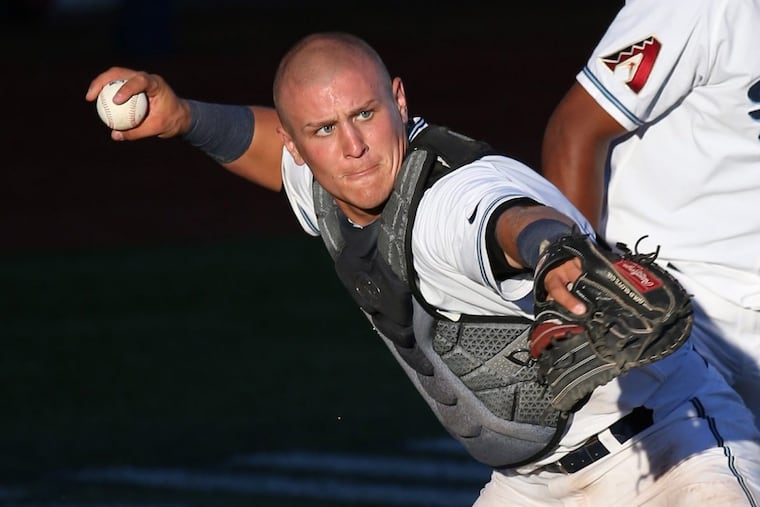 Daulton Varsho (21) of the Hillsboro Hops throws to first base after fielding a bunt during a game against Spokane on July 22.