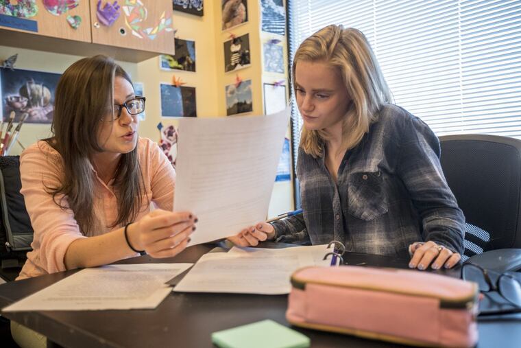 Fusion Academy art teacher Nicole Case, left, goes over a written exercise with student Paige Andreassi, 17, that asked the student to set goals for herself for 10, 20, and 30 years from now.
